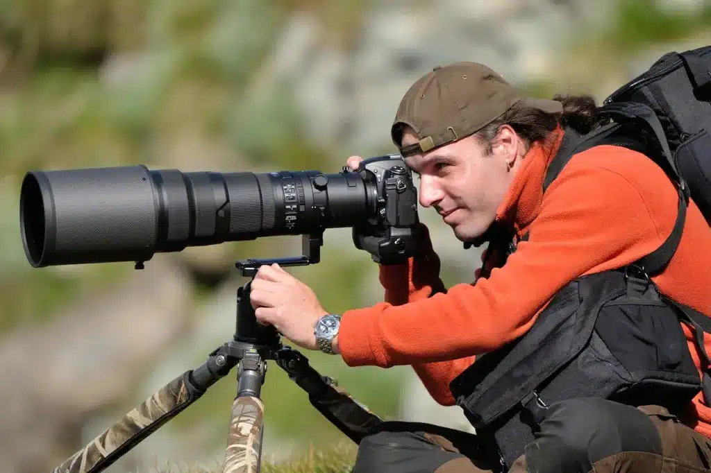 Professional Wildlife Photographer With Tripod