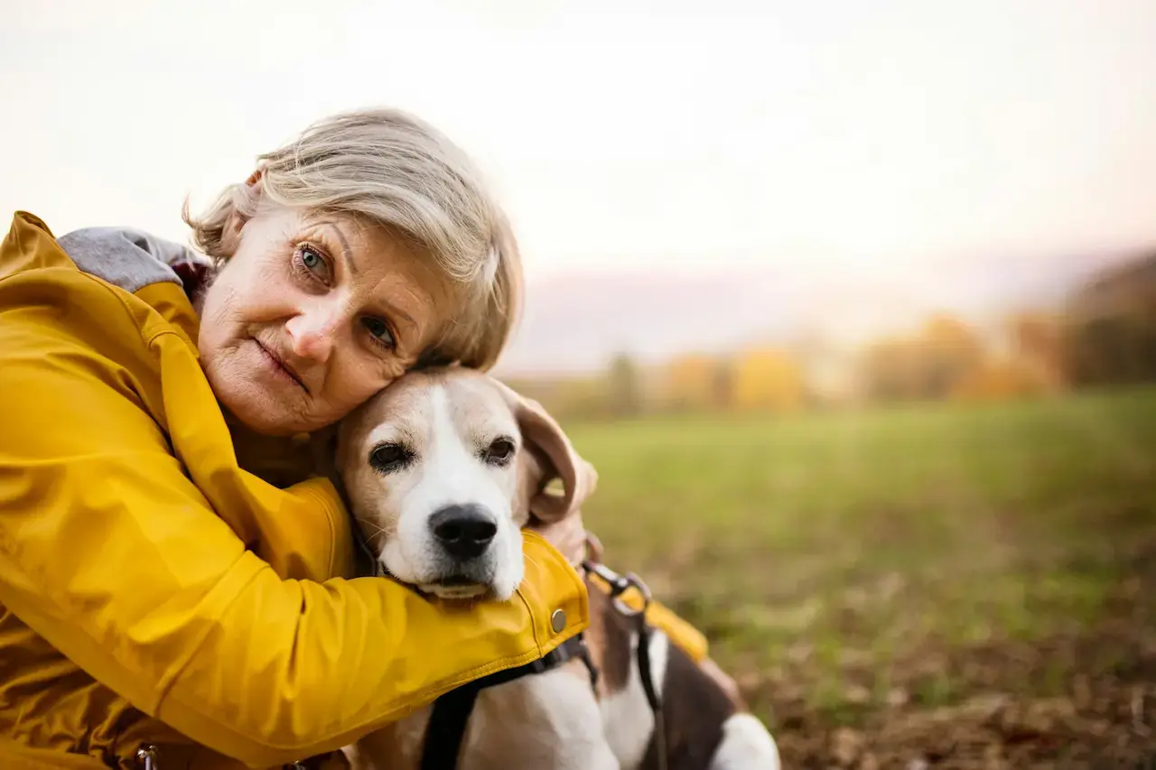 Lady Holding Old Dog